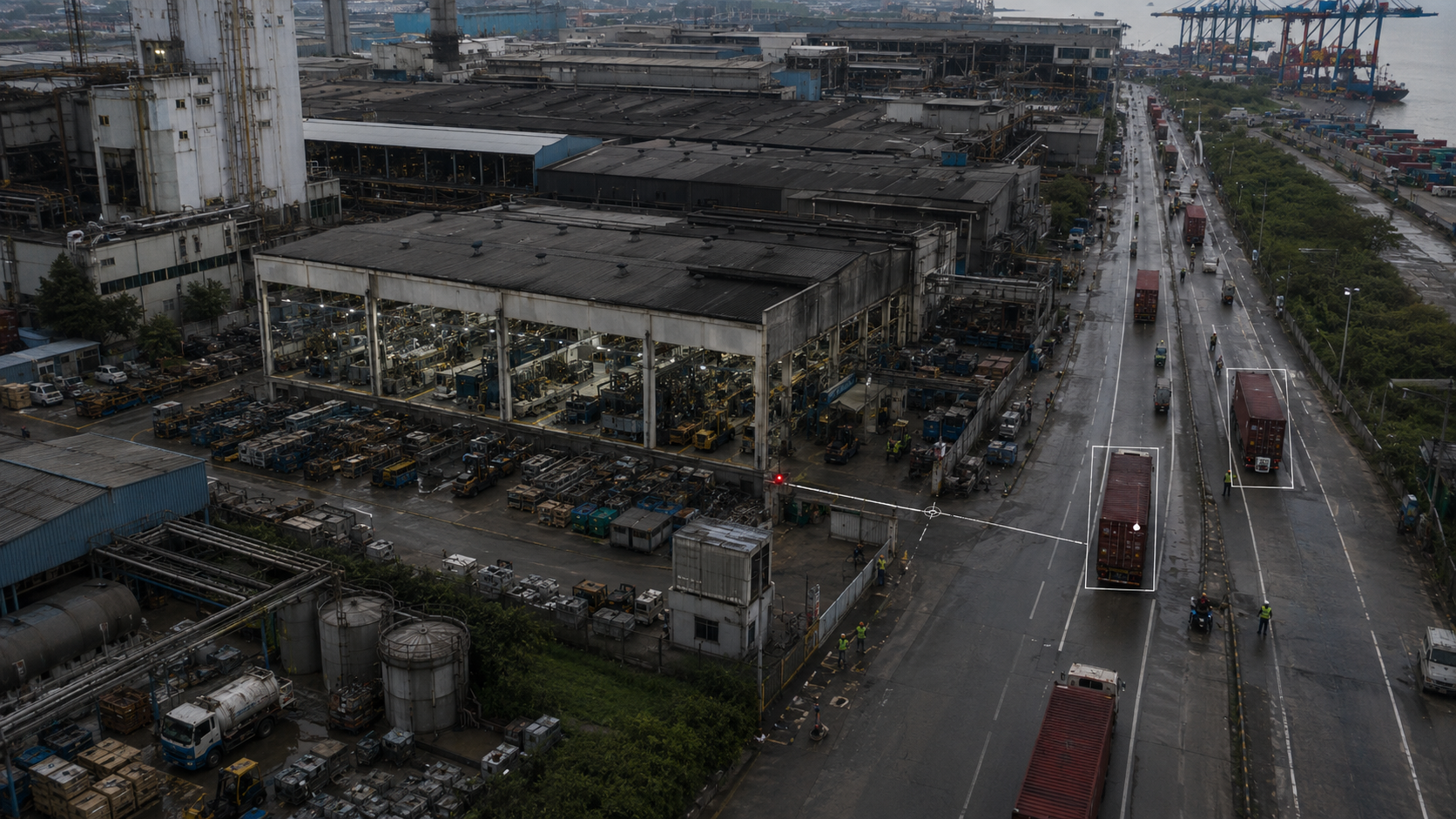 Aerial view of an Indian factory and outbound freight corridor, with audit markers tracking containers moving towards a port