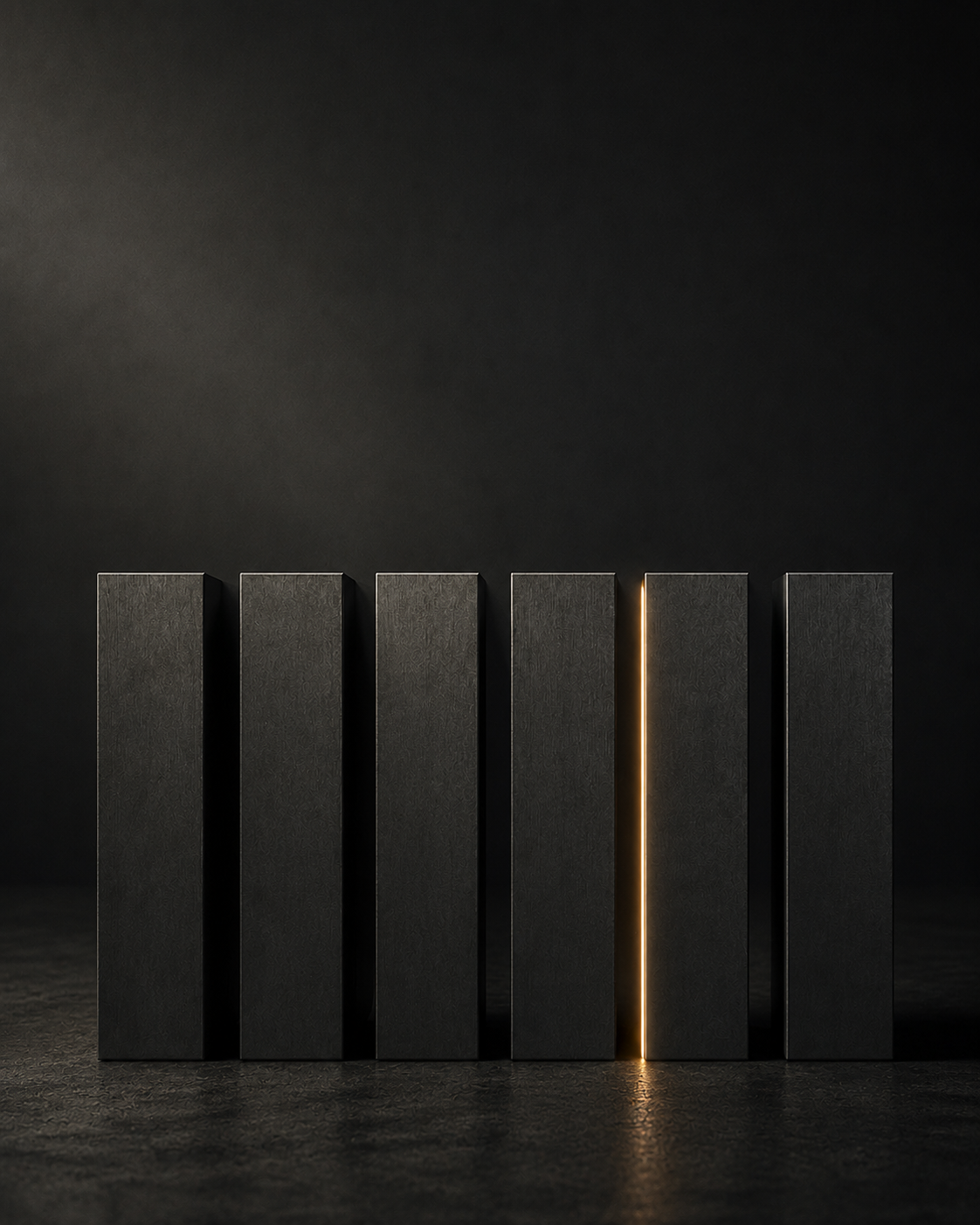 Six dark monolithic columns with a single sliver of warm light emerging between them — representing conversion potential within India's semiconductor pillars
